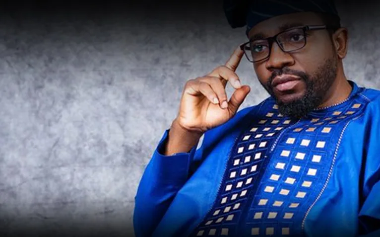 Studio portrait of a man in a blue agbada