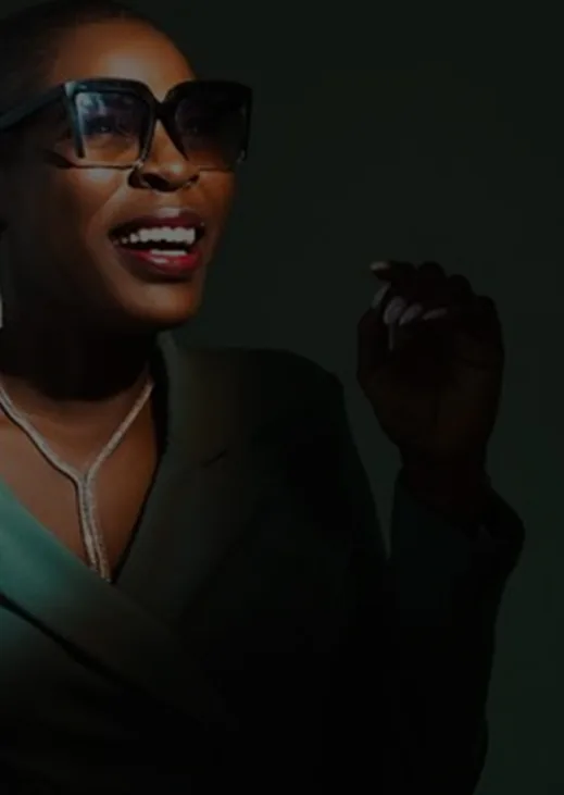Editorial portrait of a woman in a green suit
